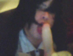 Crossdresser Eats A Dildo