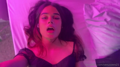 Stroking her big cock in the pink room and shooting a load on her face