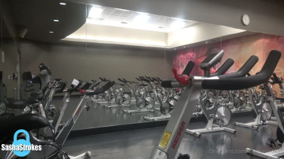 Stroking her big cock in the gym and shooting a cumshot