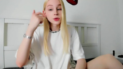 young blonde TS is jerking and licking own cum