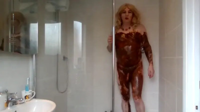 In the shower covered in chocolate