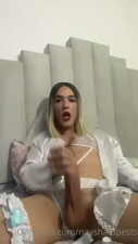 Stroking her huge cock