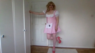 Blonde in stockings stripping out of a pink dress