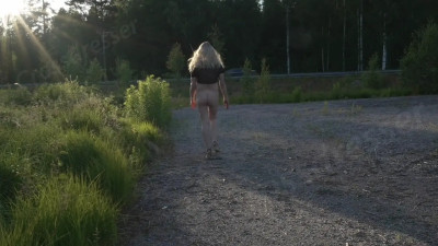 Crossdresser half-naked in woods