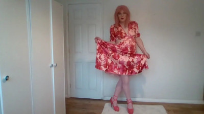 Pink stockings under a long red dress