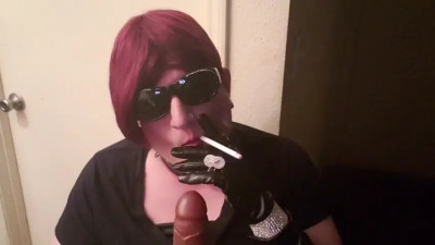 Sissy slut Mndy smoking in leather gloves