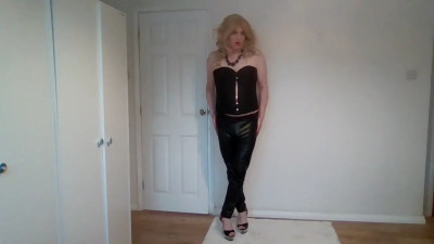 Blonde in leather trousers and corset
