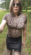 Mature crossdresser Holly pissing in the woods
