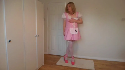 Blonde in stockings stripping out of a cute pink costume