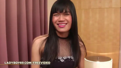 Skinny ladyboy with small tits masturbates while in fishnets