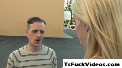 Trans sex worker giving a blowjob while riding cock