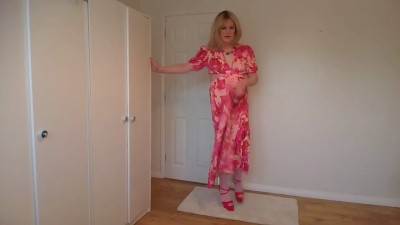 Stripping out of a long red dress
