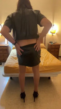 Beautiful Spanish shemale  latex miniskirt high heels  bedroom