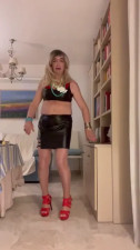 Beautiful Spanish shemale poses latex miniskirt high heels